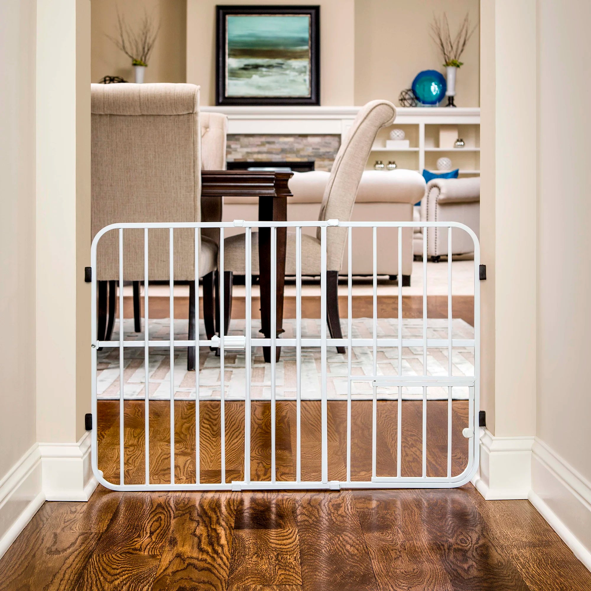 Tuffy® Pet Gate set up in a dining room and living room.