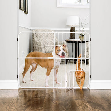 The Carlson Big Tuffy® Expandable Pet Gate in white is a sturdy, 32" tall steel gate designed to fit openings from 22" to 38". It features a pressure-mount system for quick, tool-free installation, rubber bumpers to protect walls, and a patented small pet door for easy access, making it perfect for small to large pets.