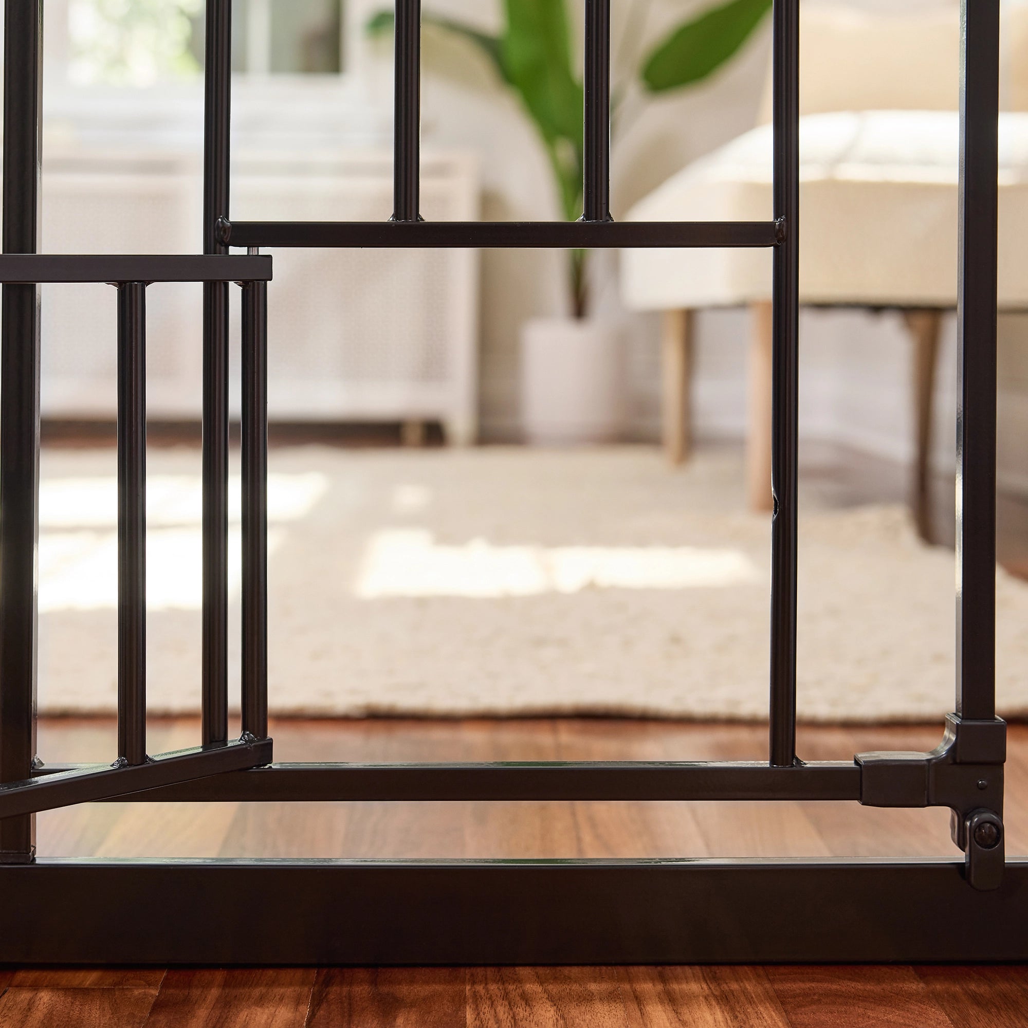 The Carlson 51” Extra Wide Walk-Thru Pet Gate features a sturdy all-steel frame, a 16.5" wide walk-through door, and a patented small pet door. It expands from 29” to 51” wide, stands 30” tall, and includes extensions for wider openings. Ideal for doorways, hallways, and stairs, offering easy installation.