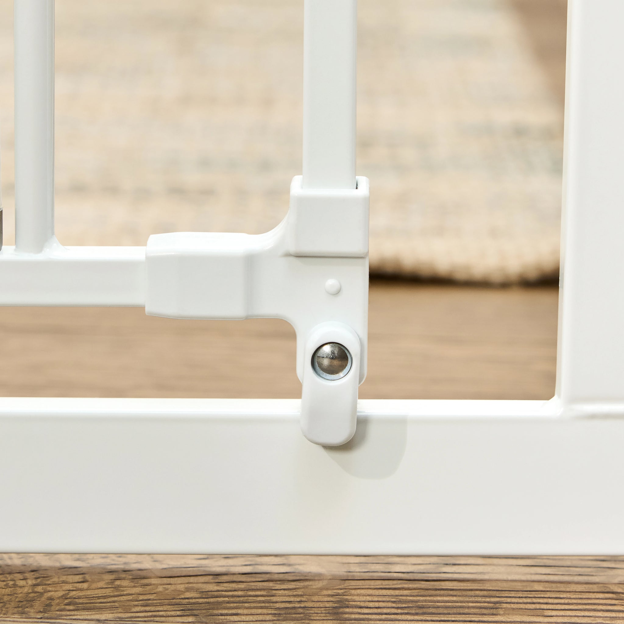 The Carlson 36” Extra Tall Walk-Thru Pet Gate with Small Pet Door in white, made of durable steel, is designed to keep pets safely contained. It features a 36” height, expandable width (29” to 36.5”), easy walk-through door, and a small pet door for small animals to pass through while keeping larger pets confined.