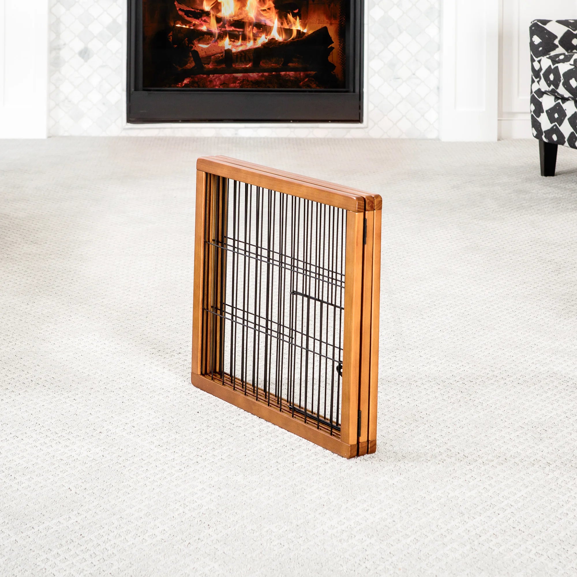 A wooden pet gate with a black metal frame, featuring three panels that fold for easy storage. It stands 20 inches tall, adjusts from 22 to 62 inches wide, and includes a small pet door for dogs to pass through. Ideal for hallways, doorways, or stairs, and requires no permanent installation.