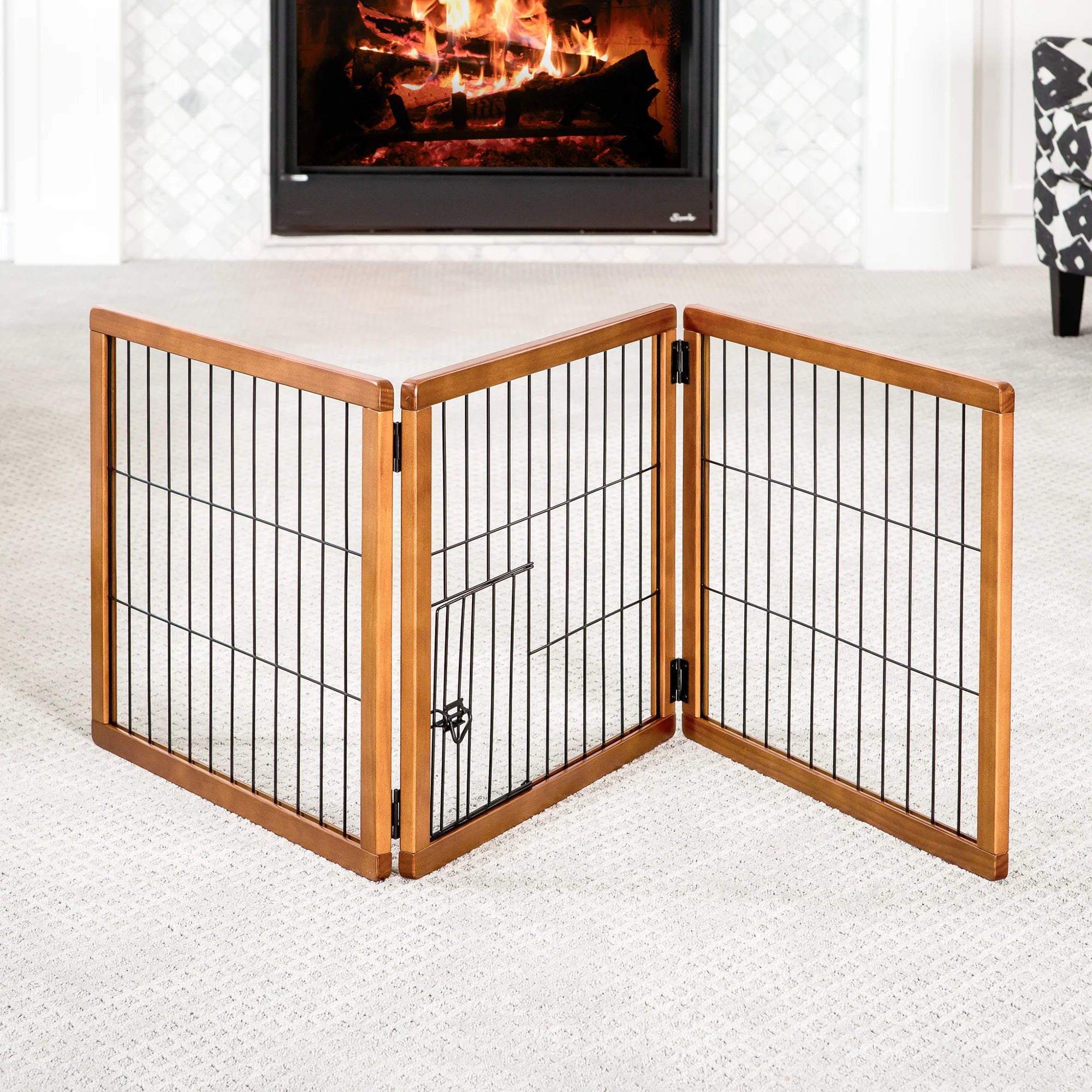 A wooden pet gate with a black metal frame, featuring three panels that fold for easy storage. It stands 20 inches tall, adjusts from 22 to 62 inches wide, and includes a small pet door for dogs to pass through. Ideal for hallways, doorways, or stairs, and requires no permanent installation.