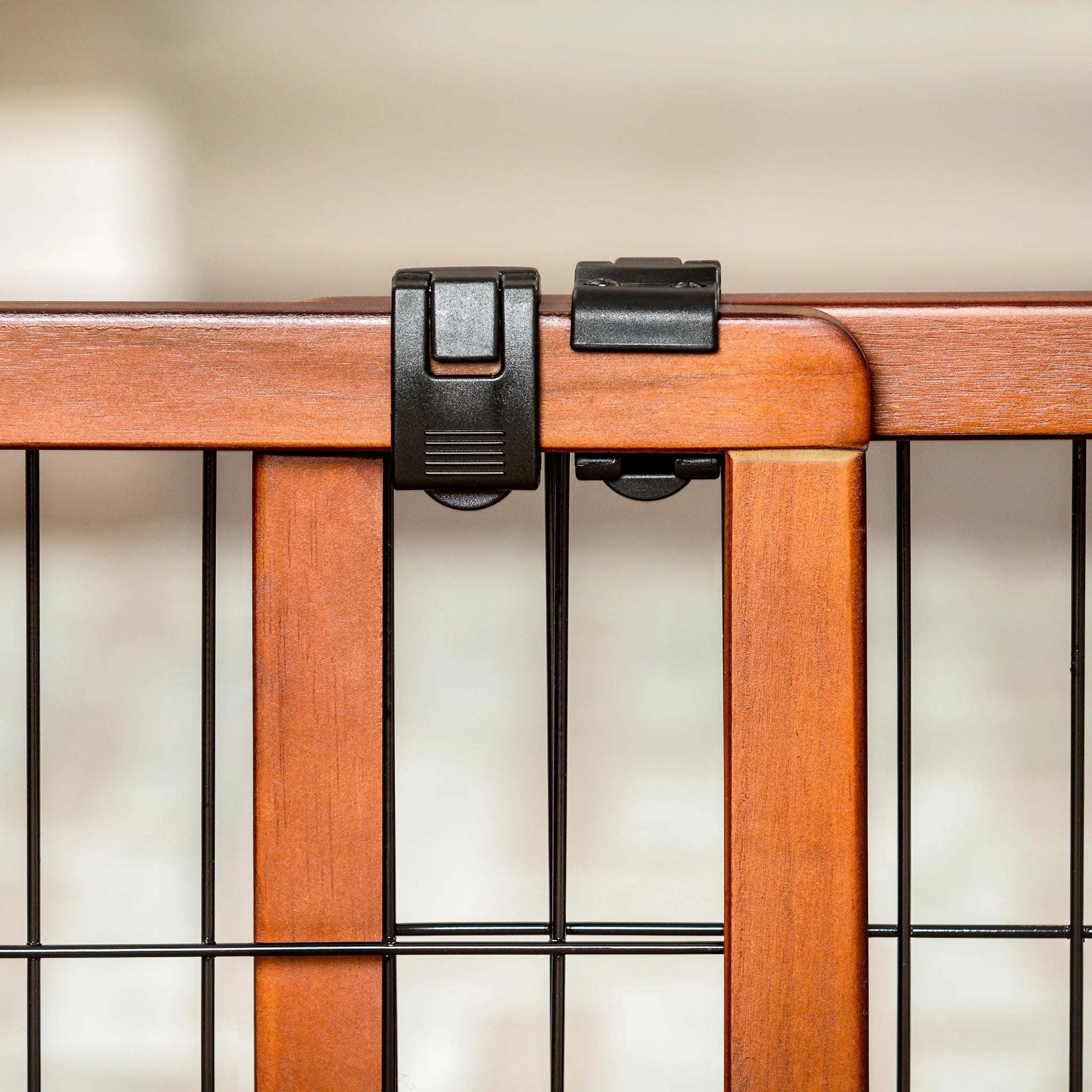 The Carlson Design Paw Extra Wide Freestanding Pet Gate features a stylish wood frame with black metal panels. Expands from 40" to 70" and stands 20" tall, providing a safe barrier for pets. Lightweight and portable, it’s easy to move and store, offering flexibility without permanent installation.