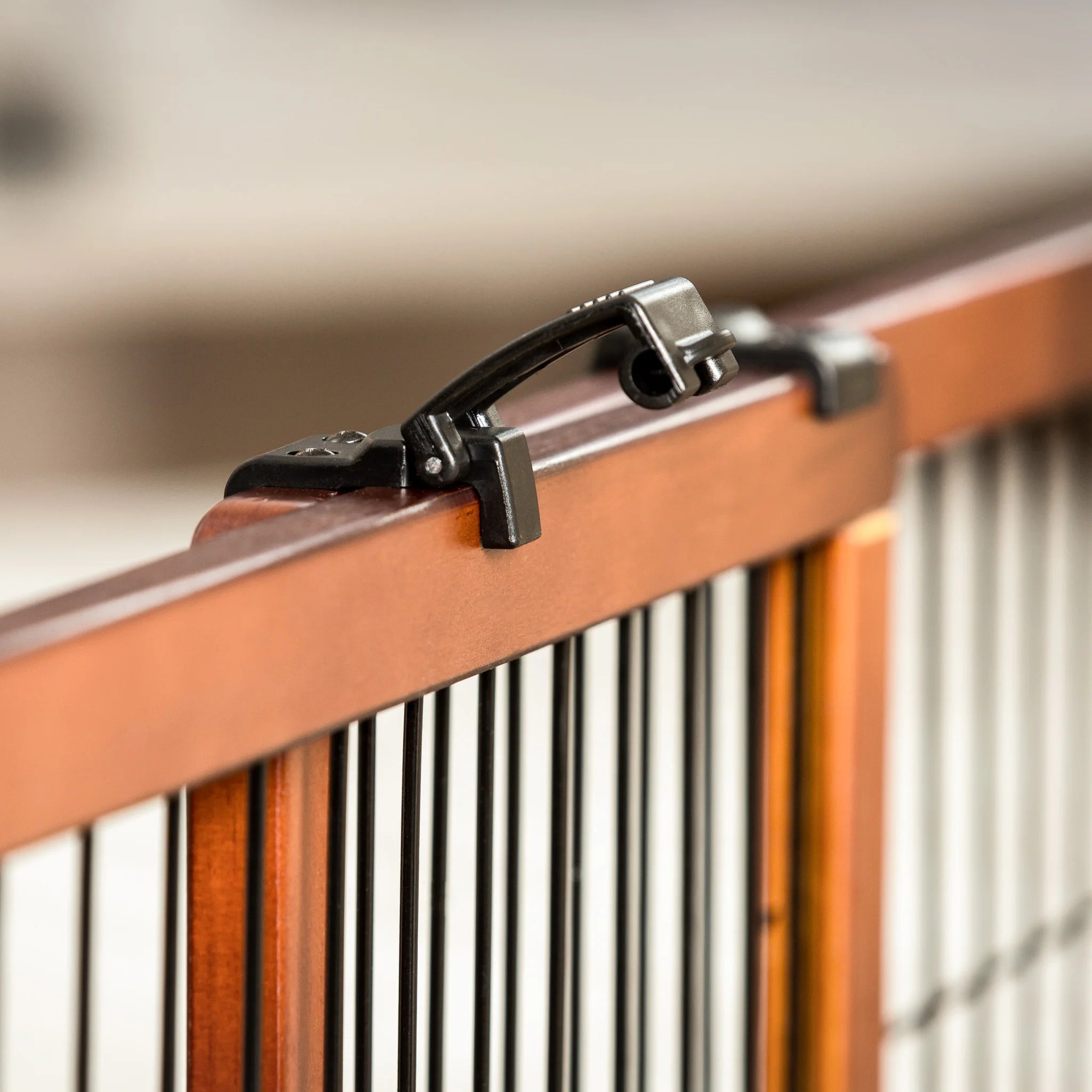 The Carlson Design Paw Extra Wide Freestanding Pet Gate features a stylish wood frame with black metal panels. Expands from 40" to 70" and stands 20" tall, providing a safe barrier for pets. Lightweight and portable, it’s easy to move and store, offering flexibility without permanent installation.