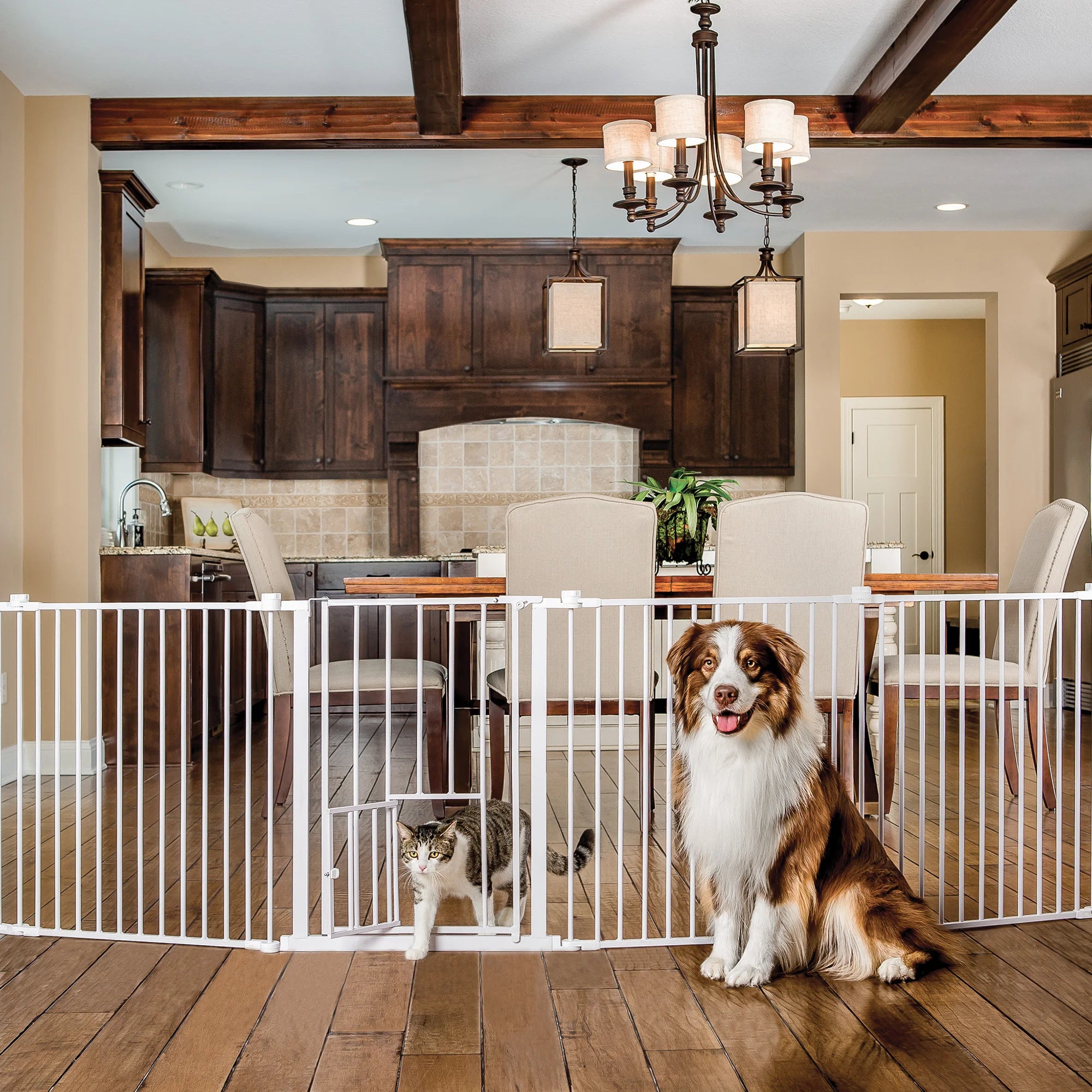 2-in-1 Super Wide Pet Pen & Gate in the kitchen with a dog in front of it with a cat walking through the Small Pet Door.