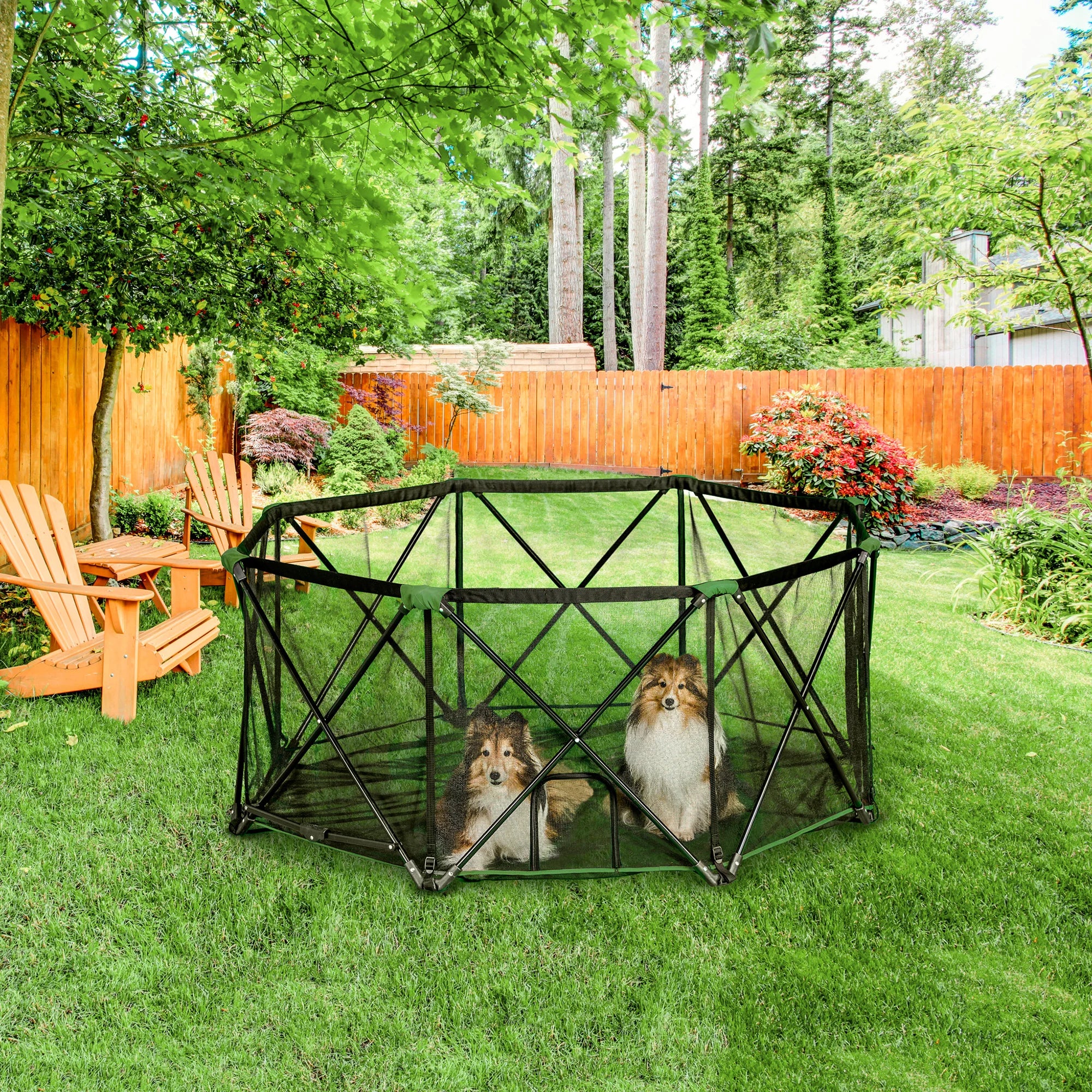 Two dogs in Portable Pet Pen while on green grass in a backyard.