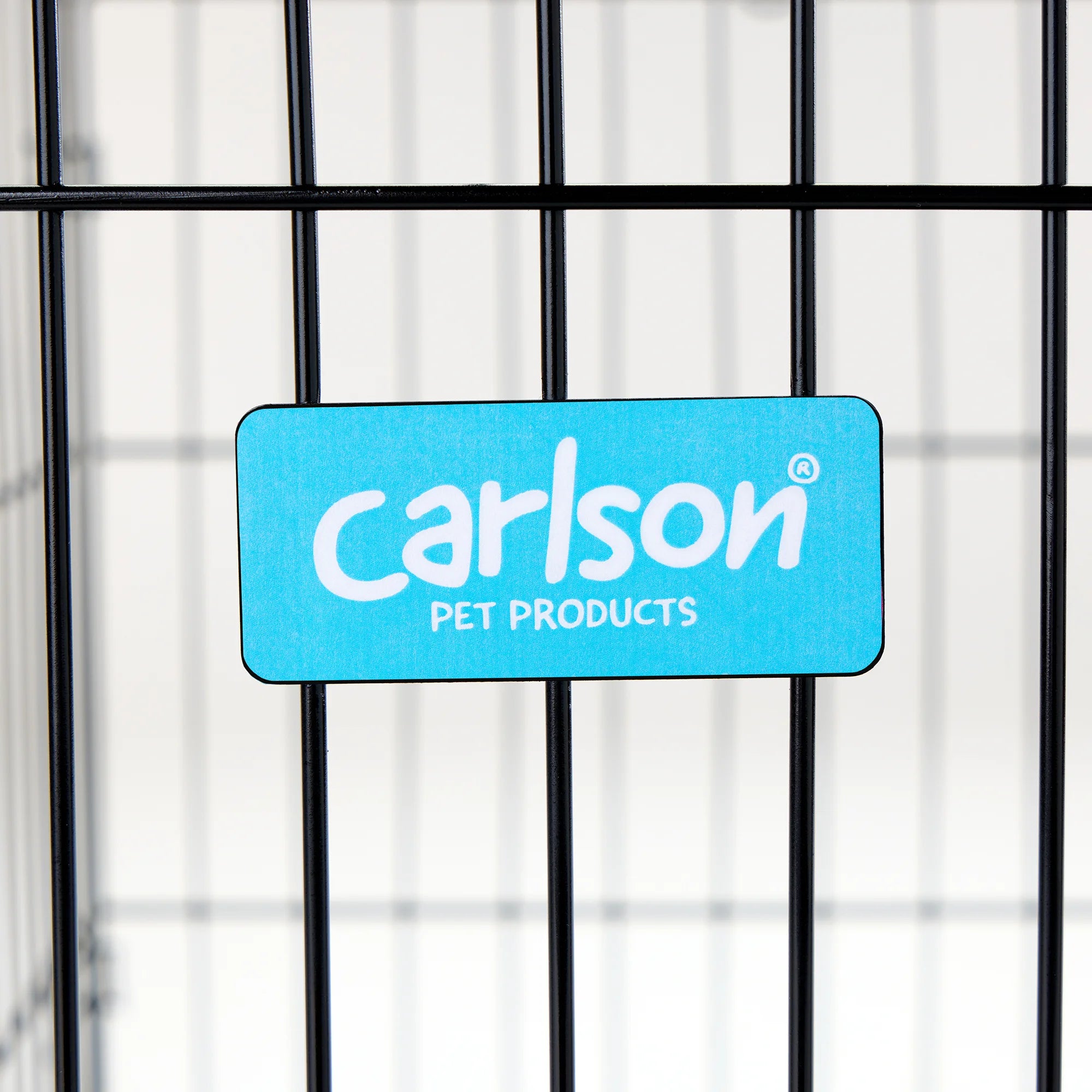 Carlson Medium Single-Door Dog Crate in black, made of durable steel wire. Measures 30” L x 19” W x 21.5” H, with a multi-point locking system for security. Folds flat for easy storage and portability. Removable bottom pan for easy cleaning. Ideal for small to medium dogs up to 24” long.