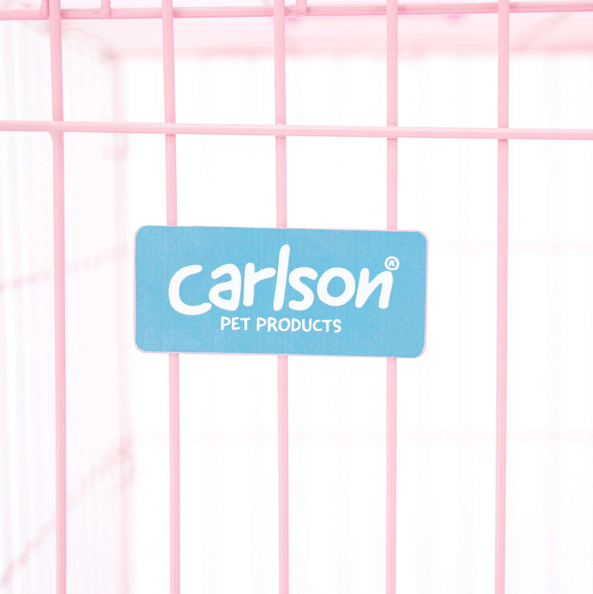 The Carlson Small Single-Door Dog Crate in pink is a durable steel wire kennel measuring 24” L x 18” W x 20.5” H. It features a multi-point locking system, a front door for easy access, and a removable bottom pan for easy cleaning. The crate folds nearly flat for convenient travel and storage. Ideal for small dogs.