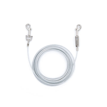 A 20-foot Carlson Medium Dog Tie-Out Cable, made from durable steel wire, designed to safely contain dogs up to 100 pounds. It includes secure collar and spring cage clasps for easy attachment, ideal for outdoor use, camping, or areas without a fenced yard, ensuring a safe, portable, and reliable solution.