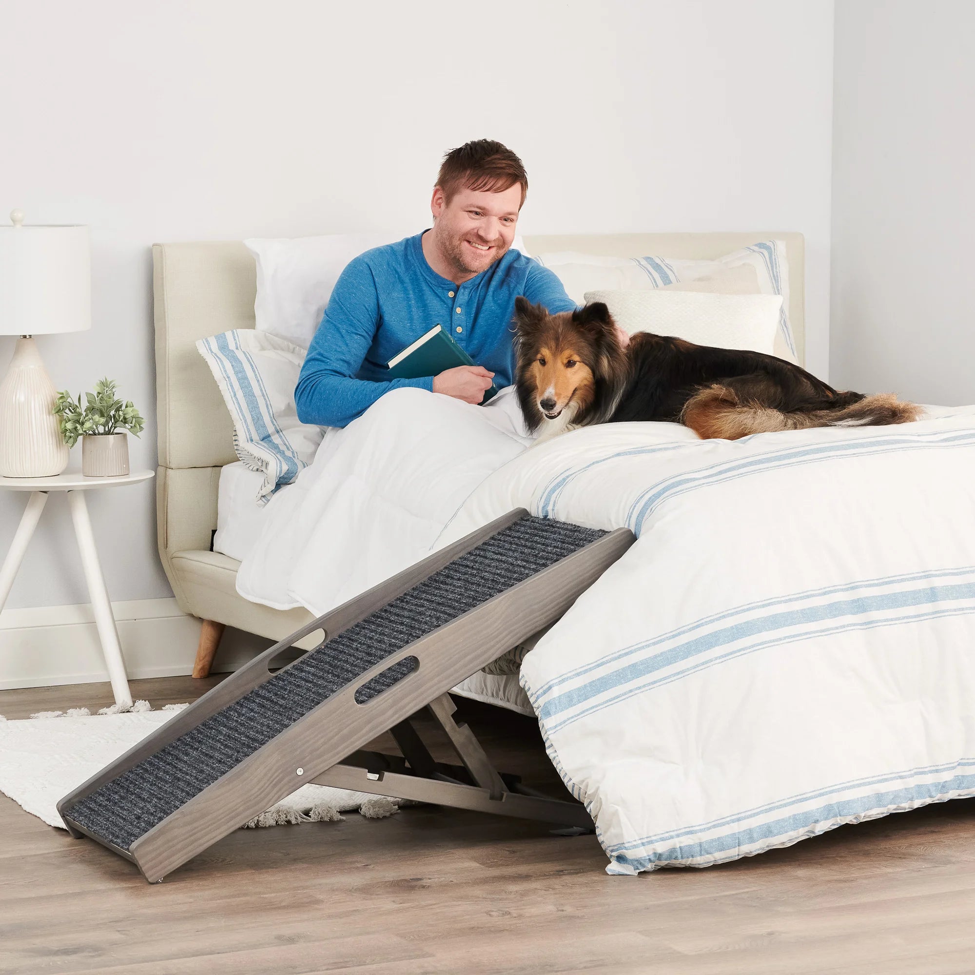 Carlson Indoor Pet Ramp in grey provides safe, easy access for pets to reach beds, couches, or chairs. Supports pets up to 80 lbs, with adjustable heights (12"-24"). Features a non-slip grey carpet, collapsible frame, and built-in handle for portability. Lightweight, durable, and easy to store.