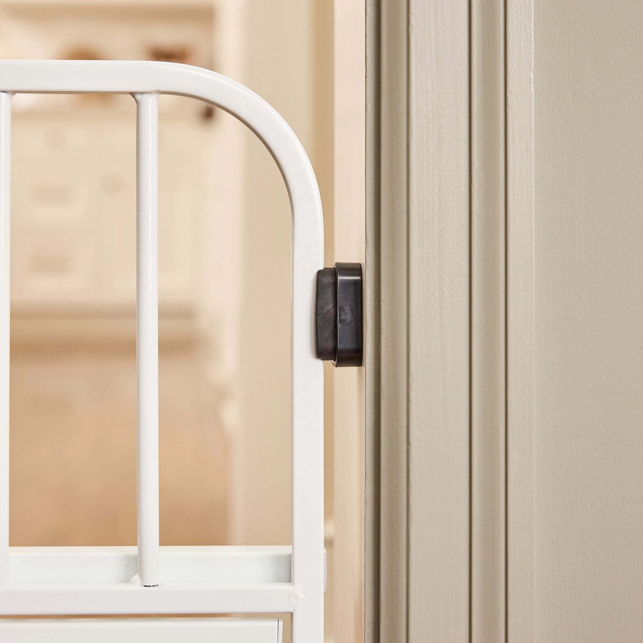 White gate against wall.