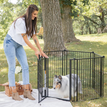 The Carlson Outdoor Super Wide Pet Pen & Gate is a versatile black steel gate with six 32” panels, expanding up to 144” wide. It features a walk-through door with a lever-style handle, a sliding safety lock, and a small pet door. Perfect for keeping pets safe outdoors, it’s weather-resistant and easy to store.