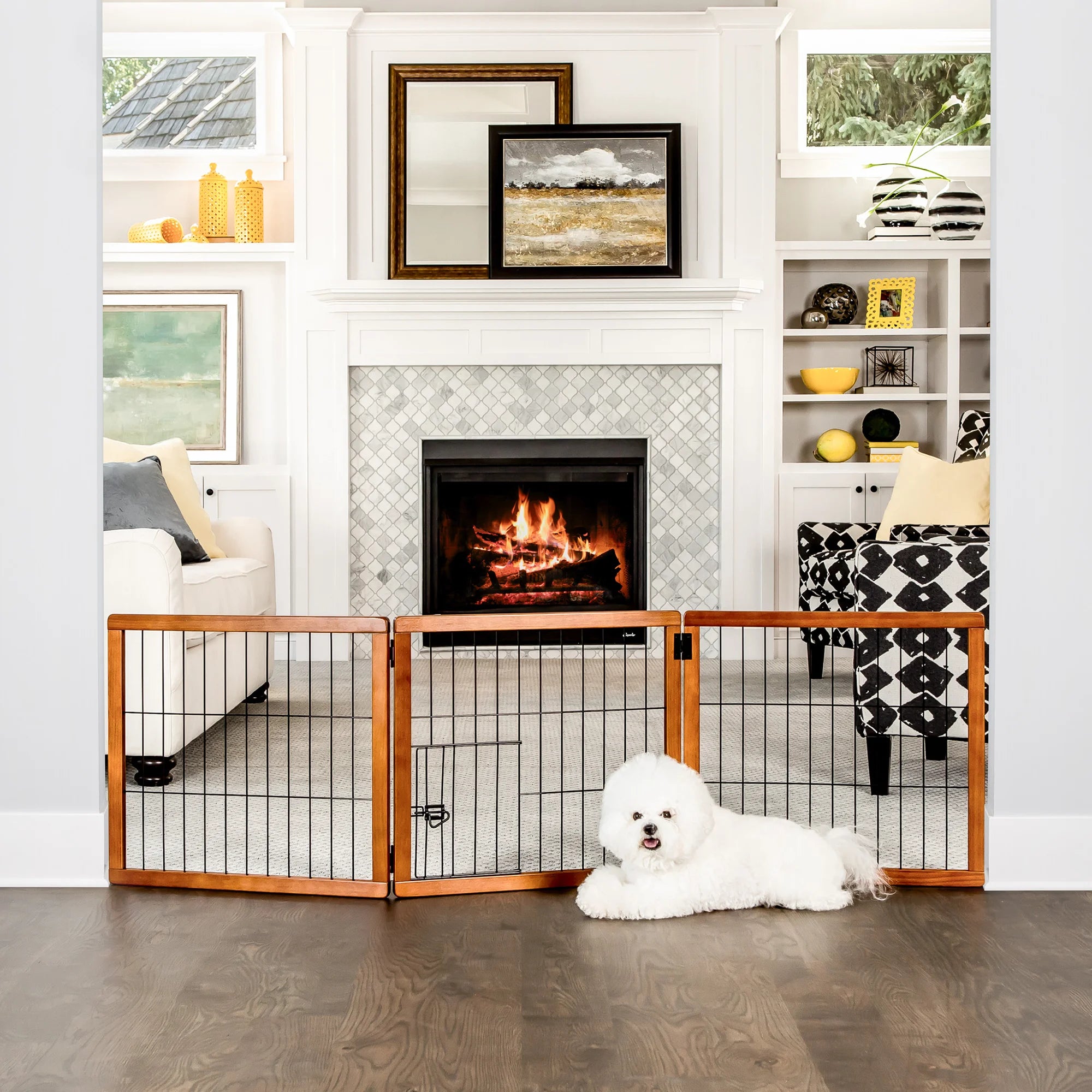 Dog sitting in front of Design Paw 3 Panel Wooden Pet Gate in living room.