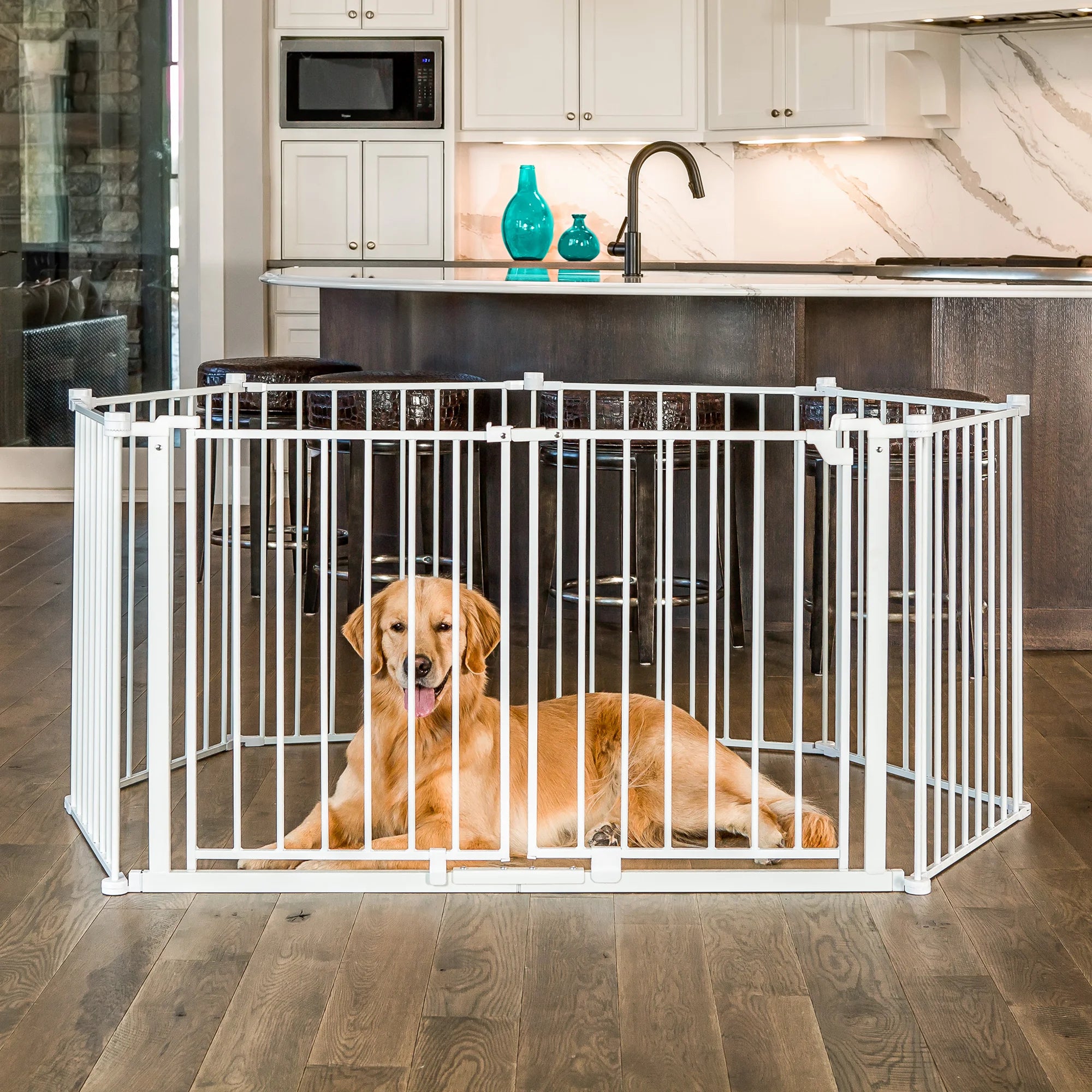 A dog sitting inside of the Double Door Super Wide Pet Gate and Pet Yard while being in a kitchen.