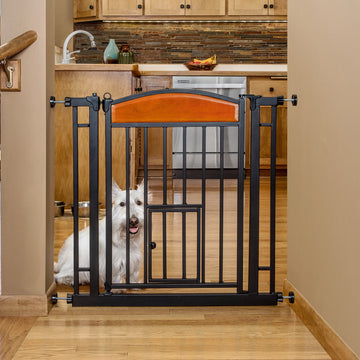 Dog sitting in kitchen behind 32" Design Paw Easy Close Walk-Thru Pet Gate.