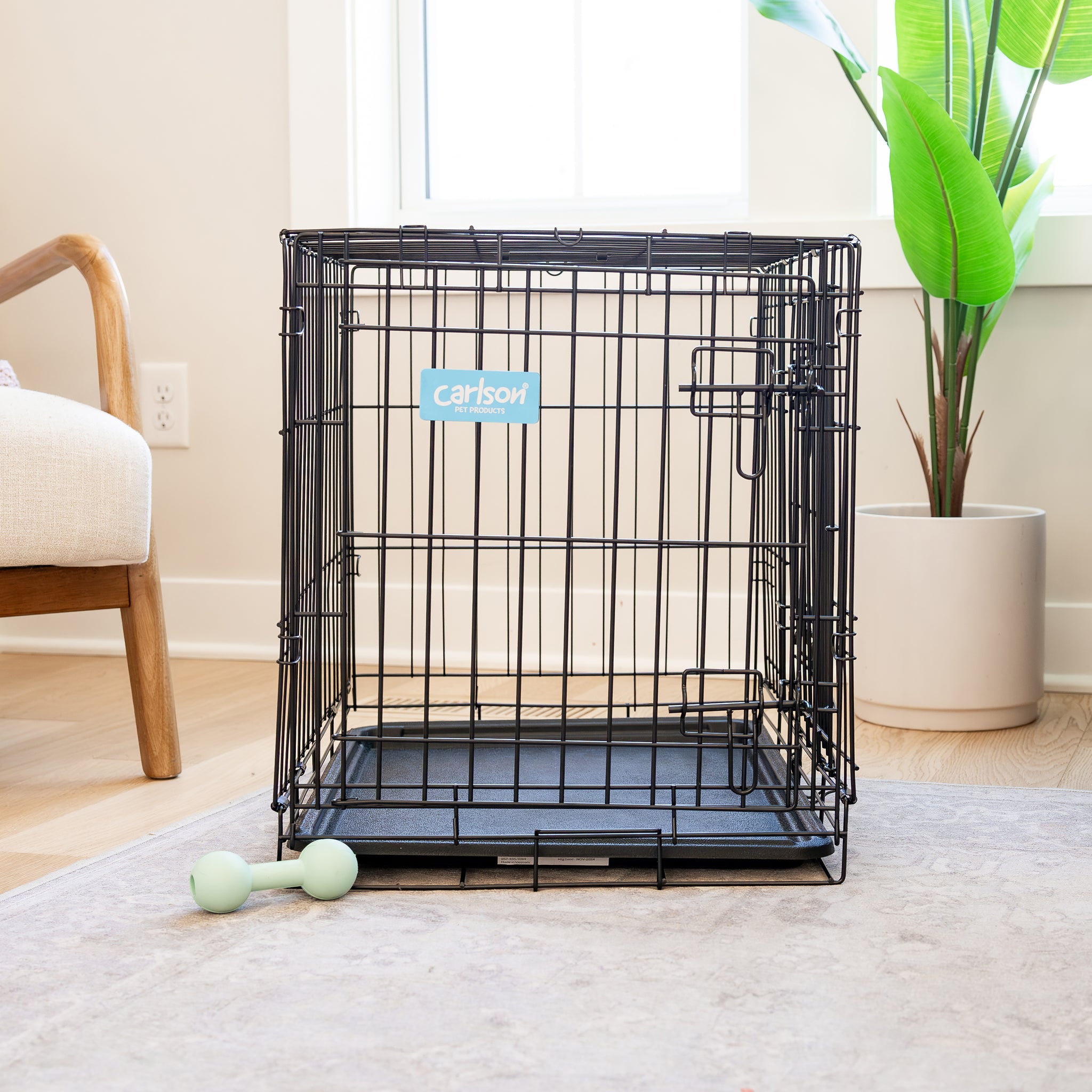 The Carlson Small Double-Door Dog Crate is a compact, durable wire crate with two doors for easy access. It features a multi-point locking system, folds flat for portability, and includes a removable bottom pan for easy cleaning. Ideal for small breeds, it includes a divider to grow with your puppy.